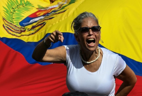 A woman shouts slogans during a rally in support of ousted Venezuelan leader Nicolas Maduro and his wife Cilia Flores in Caracas
