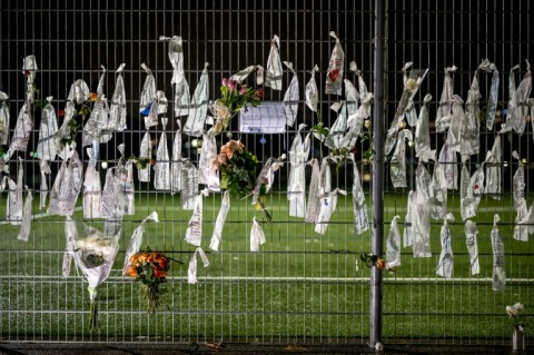 Flowers and tributes attached to the fence at the ground of Swiss club FC Lutry, which lost several young players in the blaze