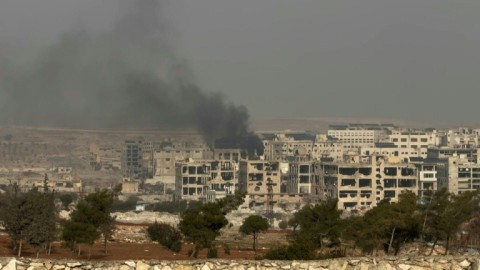 Syrian army says controls Aleppo district, Kurdish forces deny claim