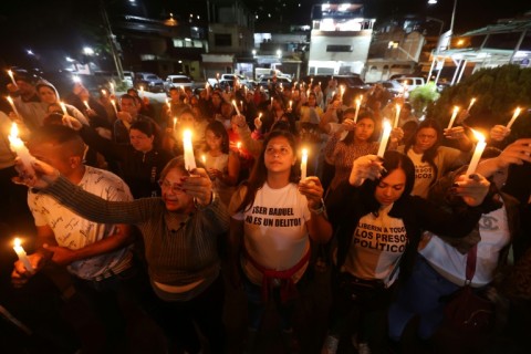Relatives of political prisoners hold a vigil outside El Rodeo prison, hoping they will be released by Venezuela's interim leaders