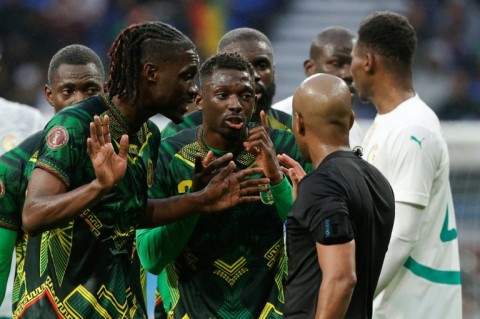 Say it ain't so: Mali's Yves Bissouma (L) gets a red card at AFCON