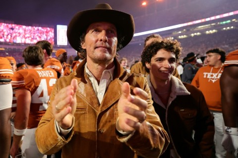 Matthew McConaughey cheers on his beloved Texas Longhorns American football team