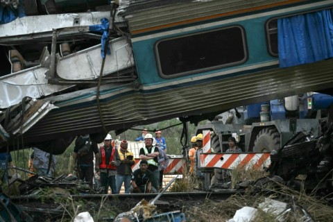 Dozens of rescuers search for missing people in the tilted carriages northeast of the Thai capital