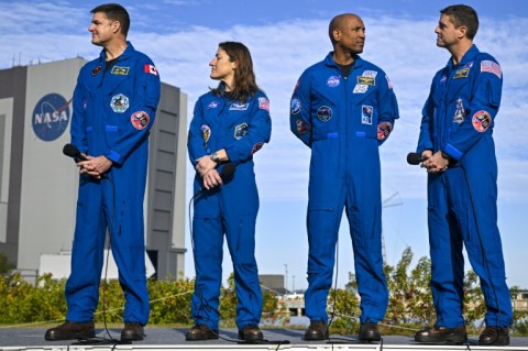 (L-R) Canadian Space Agency astronaut Jeremy Hansen, NASA astronaut Christina Koch, Victor Glover and Reid Wiseman look on during the rollout of NASA's next-generation moon rocket