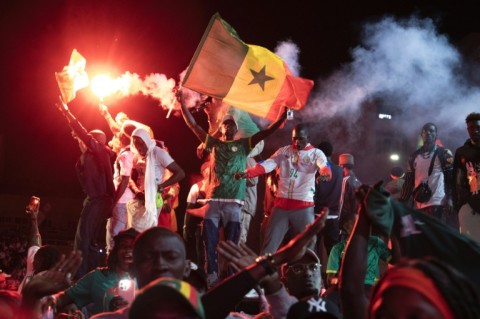 Football supporters celebrate at a 'fan zone' in Dakar on Sunday after Senegal won the Africa Cup of Nations final
