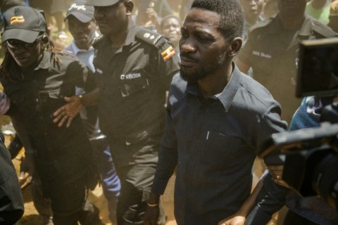 Uganda opposition leader Bobi Wine (2nd R) has been in hiding since the vote
