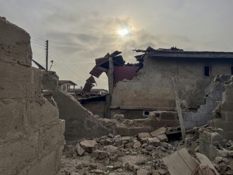 Destroyed structures in Offa, Nigeria caused by debris from expended munitions that fell from US strikes on unspecified militants linked to the Islamic State group in Nigeria