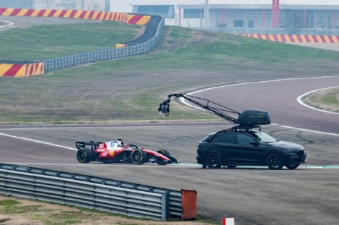 A camera crew film Charles Leclerc in the new SF-26