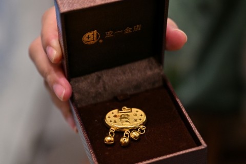 Chinese families traditionally purchase gold to mark special occasions like births and weddings
