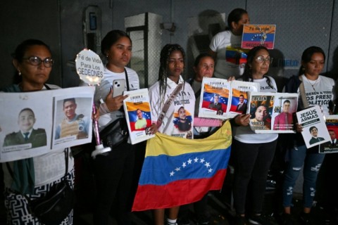 Relatives rally for the release of political prisoners outside the El Helicoide, headquarters of the Bolivarian National Intelligence Service (SEBIN), in Caracas on January 30, 2026