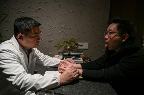 A TCM doctor diagnoses customers' based on their pulse readings, before a mixologist crafts custom drinks