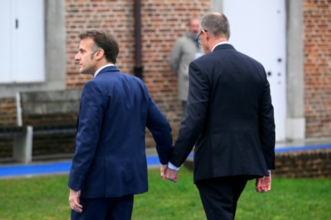 French President Emmanuel Macron and German Chancellor Friedrich Merz sought to downplay their differences before EU leaders' talks on Thursday