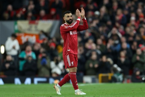 Scorer Mohamed Salah applauds Liverpool supporters after being substituted in an FA Cup victory over Brighton at Anfield.