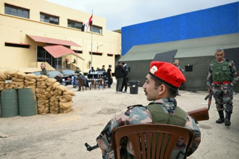 An actor dressed as a former Assad-regime soldier sits on set during the filming of an Arabic TV Series on February 17, 2026