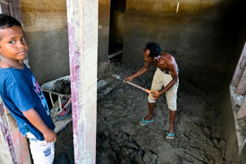 Crammed in temporary shelters or a cluster of tents, Indonesian flood survivors have little hope of returning to their mud-caked homes any time soon