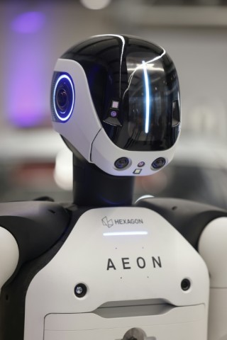 The black-and-white robots stand 1.65 metres tall, weigh 60 kilogrammes and move on two wheels