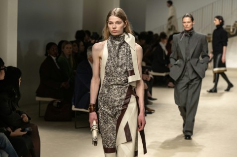 At Tod's, asymmetrical "foulard" dresses in graphic prints left the back fully exposed.