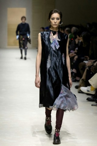 Distressed or "eaten away" fabrics were prevalent at Prada during Milan Fashion Week.