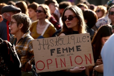 'Hysterical: woman with an opinion,' read one sign as thousands marched for women's rights Sunday