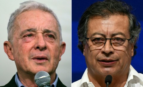 Former conservative president Alvaro Uribe, left, is running for a Senate seat, hoping to thwart leftist President Gustavo Petro, right