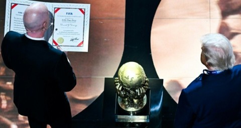 FIFA President Gianni Infantino presents the newly-created FIFA Peace Prize to US President Donald Trump at the World Cup draw