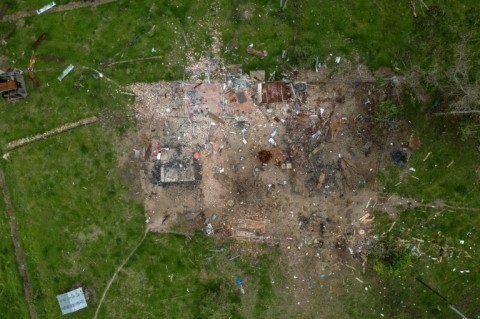 AFP visited the remote border zone where the bomb was dropped and saw three buildings reduced to rubble, their scorched zinc roofing twisted among the debris