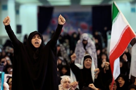 Iranian Shia women shout slogans during Eid al-Fitr prayers, marking the end of the Muslim holy month of Ramadan, at the Grand Mosalla mosque in Tehran on March 21, 2026