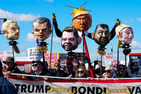 Demonstrators hold effigies of US President Donald Trump and other administration officials during the 'No Kings' national day of protest in Washington