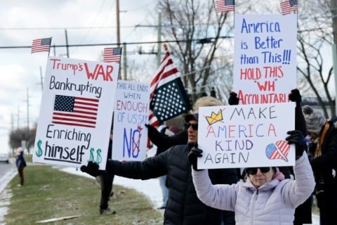 Demonstrators take part in the 'No Kings' national day of protest in West Bloomfield, Michigan, a suburb of Detroit
