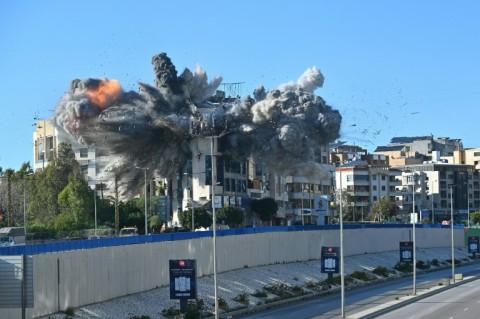An Israeli strike hits a building adjacent to the highway leading to Beirut's international airport