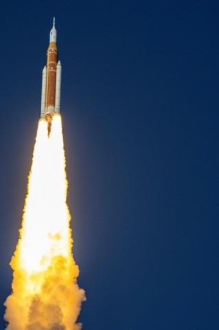 With a thunderous roar, the enormous rocket carried three Americans and one Canadian away from Kennedy Space Center