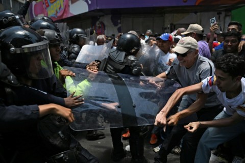 Venezuela police tear-gas protesters demanding salary rises