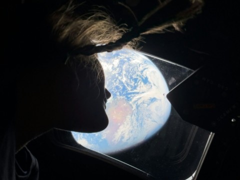 Christina Koch looking back at earth through the window of the Orion spacecraft on April 2, 2026