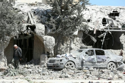 A man checks the site of an Israeli airstrike that targeted a religious Shia complex in the southern Lebanese coastal city of Sidon