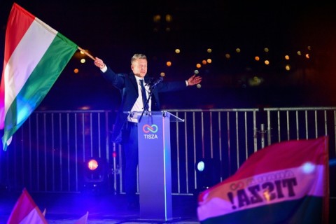 The PM-elect, who arrived waving the Hungarian flag, told the cheering crowd that voters had 'liberated Hungary'