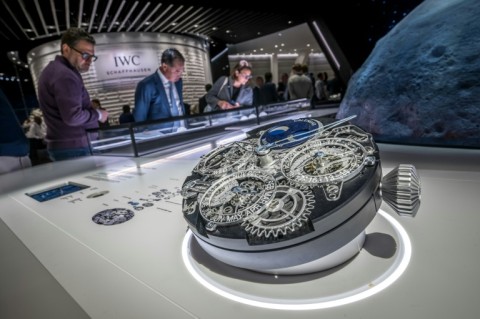 The IWC stand features a replica timepiece depicting its movement mechanisms