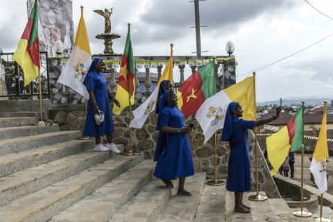 The pope blessed crowds from the back of a vehicle with bulletproof windows