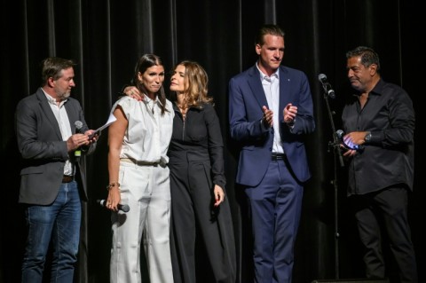 Laetitia Brodard-Sitre, in white, lost her son Arthur in the Crans-Montana fire disaster