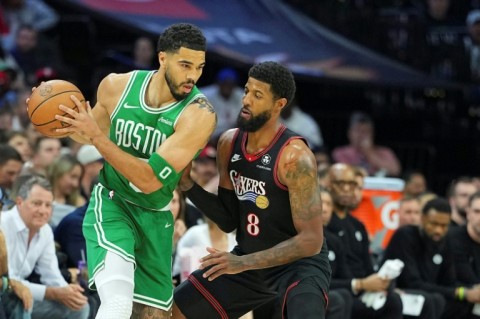 Jayson Tatum of the Boston Celtics drives against Paul George in the Celtics' victory over the Philadelphia 76ers in game three of their NBA playoff series