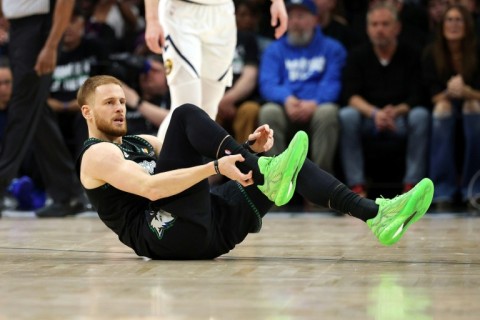 Minnesota's Donte DiVincenzo is injured in the Timberwolves NBA playoff win over the Denver Nuggets