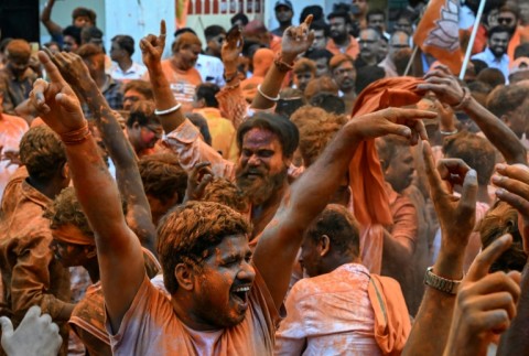 Bharatiya Janata Party (BJP) supporters celebrate after taking a lead in West Bengal legislative elections in Kolkata, as Indian Prime Minister Narendra Modi claimed a "record" victory in the key polls