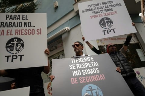 Dockers held placards reading 'Respect Tenerife -- we are not second-class' as they protested against the arrival of the MV Hondius
