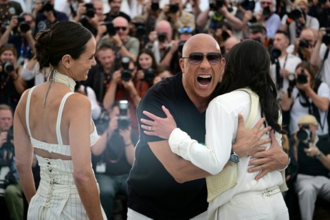 Vin Diesel hugs Michelle Rodriguez as US actress Jordana Brewster looks on