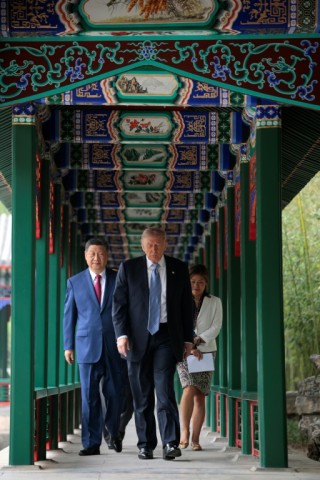 US President Donald Trump walks with China’s President Xi Jinping the gardens of Zhongnanhai, a central leadership compound next to Beijing's Forbidden City