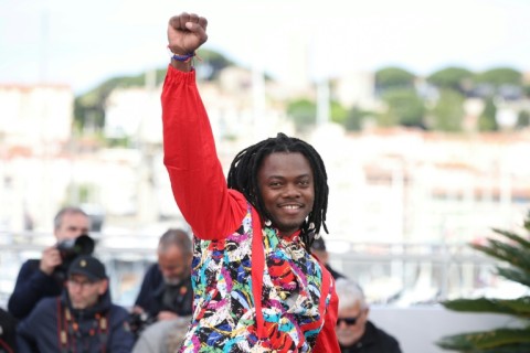 Congolese director Rafiki Fariala celebrates at the premiere of his film 'Congo Boy' at Cannes