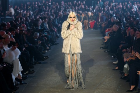 Women were dressed in satiny, shiny fabrics, leather, leopard prints, fur and high heels