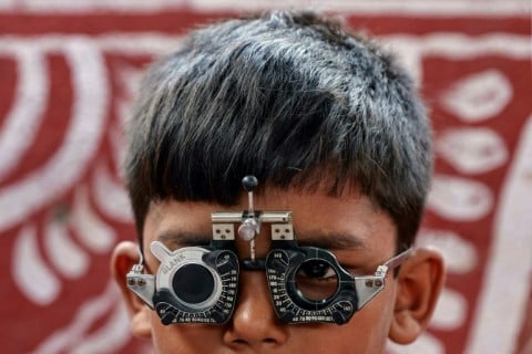 A boy undergoes a free eye test at a screening camp in the Salia Sahi slum area of Bhubaneswar