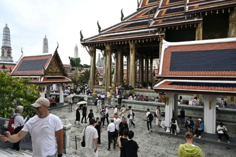 Visitors walking around the Grand Palace in Bangkok