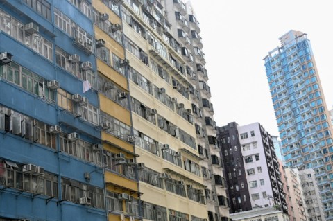 The Yee Wa Building (L) in Cheung Sha Wan, where subdivided housing units are home to people in Kowloon, Hong Kong