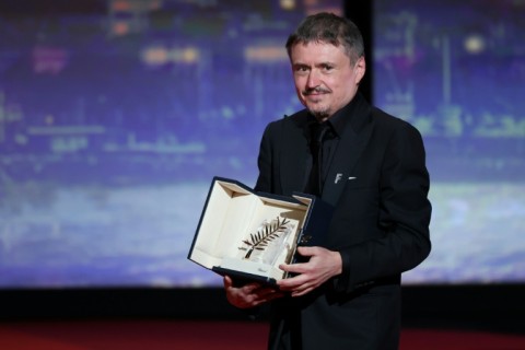 Romanian director and screenwriter Cristian Mungiu receives his Palme d'Or for best film for 'Fjord'